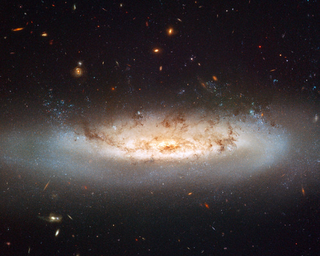 Illustration for article titled Mangled Galaxies Racing At Over 6 Million Miles Per Hour